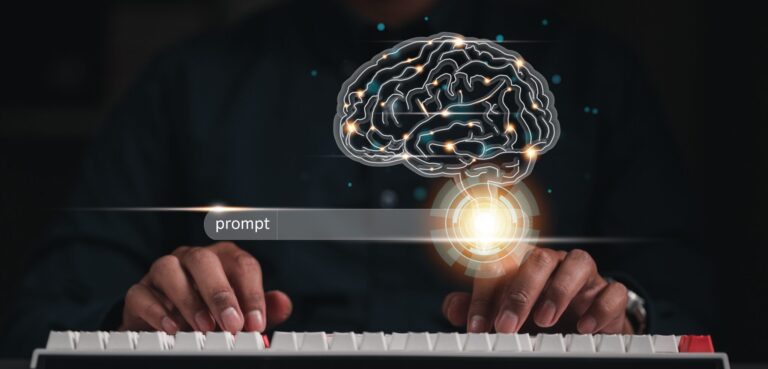 Stock photo of a 2D digital brain and search engine bar floating above someone's typing hands
