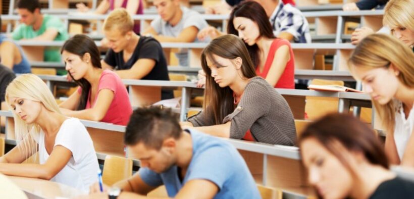 Students in a large lecture hall